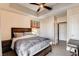 Well-lit bedroom with a bed, closet, and modern sliding-door bathroom at 83 E Agate Ave # 207, Las Vegas, NV 89123