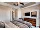 Bright bedroom featuring a comfortable bed, large dresser, and small study area at 83 E Agate Ave # 207, Las Vegas, NV 89123