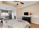 Bedroom with ceiling fan, adjacent study area, and a large dresser at 83 E Agate Ave # 207, Las Vegas, NV 89123