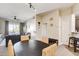 A cozy dining area with woven chairs, seamlessly connected to the living room and outdoor balcony at 83 E Agate Ave # 207, Las Vegas, NV 89123
