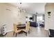 The dining room provides a comfortable transition to the living room and balcony views at 83 E Agate Ave # 207, Las Vegas, NV 89123
