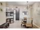 Charming dining area featuring a modern light fixture and adjacent kitchen space at 83 E Agate Ave # 207, Las Vegas, NV 89123