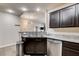 This lovely kitchen is complete with granite countertops, stainless steel appliances, and dark cabinetry at 83 E Agate Ave # 207, Las Vegas, NV 89123