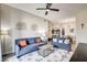Comfortable living room featuring stylish sofas, a coffee table, and bright, airy lighting at 83 E Agate Ave # 207, Las Vegas, NV 89123