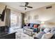 Inviting living room showcasing cozy furniture, a ceiling fan, and decorative wall art at 83 E Agate Ave # 207, Las Vegas, NV 89123