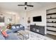 Cozy living room with comfortable seating, modern decor, and a large flatscreen TV at 83 E Agate Ave # 207, Las Vegas, NV 89123
