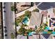 Backyard aerial of a private pool, outdoor kitchen, and lush garden provides a tranquil retreat at 9008 Sawhill Pond St, Las Vegas, NV 89131