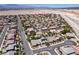 Community aerial captures homes, some with solar panels, near the desert with mountain views in the background at 9008 Sawhill Pond St, Las Vegas, NV 89131
