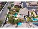 A scenic aerial view shows the private backyard with a pool, desert landscaping, and a covered patio at 9008 Sawhill Pond St, Las Vegas, NV 89131