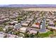 Neighborhood aerial view displays many single-Gathering homes, manicured lawns, and proximity to desert landscape at 9008 Sawhill Pond St, Las Vegas, NV 89131