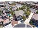 An aerial view captures the home's manicured landscaping, multiple car garage, and proximity to neighborhood amenities at 9008 Sawhill Pond St, Las Vegas, NV 89131