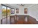 A bright and spacious bedroom with hardwood floors and access to a private balcony at 9008 Sawhill Pond St, Las Vegas, NV 89131
