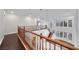Open foyer showcases hardwood floors, staircase, and views of the backyard and upstairs at 9008 Sawhill Pond St, Las Vegas, NV 89131