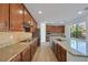 A gourmet kitchen boasts granite countertops, stainless appliances, and ample cabinet space at 9008 Sawhill Pond St, Las Vegas, NV 89131