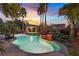 Beautiful backyard pool with rock waterfall feature and a covered gazebo at 9008 Sawhill Pond St, Las Vegas, NV 89131