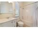 Clean bathroom features a vanity, toilet, mirror, shower and bath combo, and a window for natural light at 9025 Loggers Mill Ave, Las Vegas, NV 89143