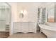 Spacious bathroom with custom vanity, clawfoot tub, and walk-in closet at 9025 Loggers Mill Ave, Las Vegas, NV 89143