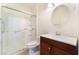 Bathroom featuring glass-enclosed shower and dark wood vanity with white countertop at 9025 Loggers Mill Ave, Las Vegas, NV 89143