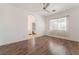 Bedroom features wood-look floors, ceiling fan, and an attached bathroom at 9025 Loggers Mill Ave, Las Vegas, NV 89143
