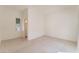 Bright bedroom with tile flooring, a window with blinds, and an ensuite bathroom at 9025 Loggers Mill Ave, Las Vegas, NV 89143