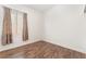 Bright bedroom features wood-look floors and a large window at 9025 Loggers Mill Ave, Las Vegas, NV 89143