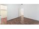 Empty bedroom with wood flooring, closet, and adjoining room view at 9025 Loggers Mill Ave, Las Vegas, NV 89143