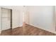 Bedroom features wood-look floors and custom built-in closet at 9025 Loggers Mill Ave, Las Vegas, NV 89143