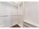 Spacious walk-in closet with built-in shelving and chrome hanging racks providing ample storage space at 9025 Loggers Mill Ave, Las Vegas, NV 89143