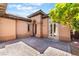 Stunning courtyard with brick pavers, accent lighting, and arched entryways at 9025 Loggers Mill Ave, Las Vegas, NV 89143