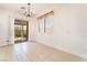 Dining area featuring tile floors and sliding glass doors at 9025 Loggers Mill Ave, Las Vegas, NV 89143