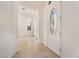Bright foyer with tile floors leading to a decorative front door at 9025 Loggers Mill Ave, Las Vegas, NV 89143