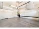 Spacious garage with overhead storage racks and clean concrete floor at 9025 Loggers Mill Ave, Las Vegas, NV 89143