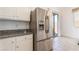 Bright kitchen with stainless steel refrigerator and granite countertops at 9025 Loggers Mill Ave, Las Vegas, NV 89143