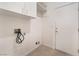 Functional laundry area with utility connections and storage space at 9025 Loggers Mill Ave, Las Vegas, NV 89143