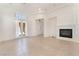 Bright living room featuring tile floors, fireplace, and entry to the home at 9025 Loggers Mill Ave, Las Vegas, NV 89143