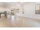 Spacious living area with recessed lighting, tile flooring, neutral paint, and access to the backyard patio at 9025 Loggers Mill Ave, Las Vegas, NV 89143