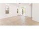 Living room featuring tile floors and windows at 9025 Loggers Mill Ave, Las Vegas, NV 89143