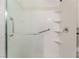 Bright shower features grab bars and built in shelving at 9025 Loggers Mill Ave, Las Vegas, NV 89143