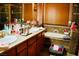 Spacious bathroom featuring a dual sink vanity, a relaxing soaking tub, and warm, inviting decor at 9355 W Viking Rd, Las Vegas, NV 89147