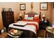 Well-decorated bedroom featuring a decorative bed, dresser and lamps at 9355 W Viking Rd, Las Vegas, NV 89147