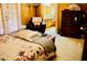 Serene bedroom featuring warm tones, a floral comforter, and dark wood furniture for a relaxing retreat at 9355 W Viking Rd, Las Vegas, NV 89147