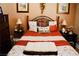 Cozy bedroom with a decorative bed, side tables and lamps at 9355 W Viking Rd, Las Vegas, NV 89147