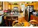 Spacious kitchen with stainless steel appliances, wood cabinets, and a breakfast bar at 9355 W Viking Rd, Las Vegas, NV 89147
