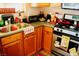 Charming kitchen with stainless steel oven, wood cabinets, and a double sink at 9355 W Viking Rd, Las Vegas, NV 89147