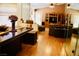 Living room and dining room with wooden floors, furniture, decor and view at 9355 W Viking Rd, Las Vegas, NV 89147