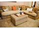 Relaxing living room showcasing comfortable sectional sofa, ottoman, and plush carpeting at 9355 W Viking Rd, Las Vegas, NV 89147