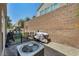 Enclosed backyard with grill, patio furniture and small playhouse. Perfect for outdoor entertaining and play at 9431 Mad Dog St, Las Vegas, NV 89178