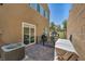 Enclosed backyard with a covered grill and small playhouse. Ready for outdoor living and play at 9431 Mad Dog St, Las Vegas, NV 89178
