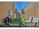 Backyard area featuring grill, playhouse and seating, making it perfect for Gathering fun and entertainment at 9431 Mad Dog St, Las Vegas, NV 89178