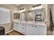 Clean bathroom with double sinks, ample counter space, and a large mirror at 9431 Mad Dog St, Las Vegas, NV 89178